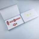 Dsmile rožu kvarca vibrācijas masāžas rullītis sejai iepakojumā